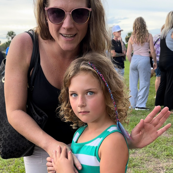 daughter and mother and the daughter has a single braid